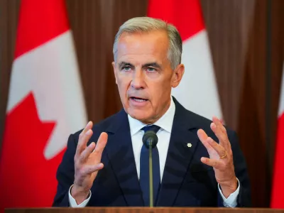 Canada's Prime Minister Mark Carney speaks with the news media after he suspended trade negotiations with the United States, in Ottawa, Ontario, Canada August 22, 2026. REUTERS/Chris Tanouye