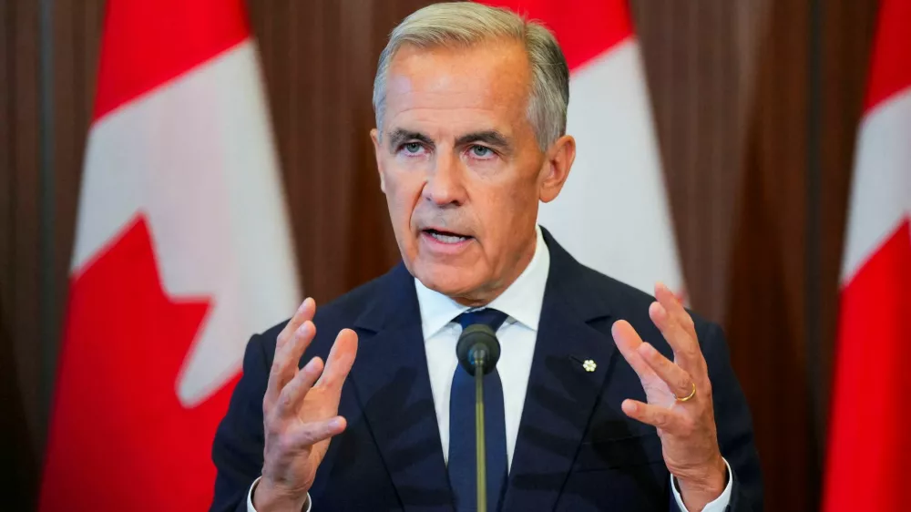 Canada's Prime Minister Mark Carney speaks with the news media after he suspended trade negotiations with the United States, in Ottawa, Ontario, Canada August 22, 2026. REUTERS/Chris Tanouye