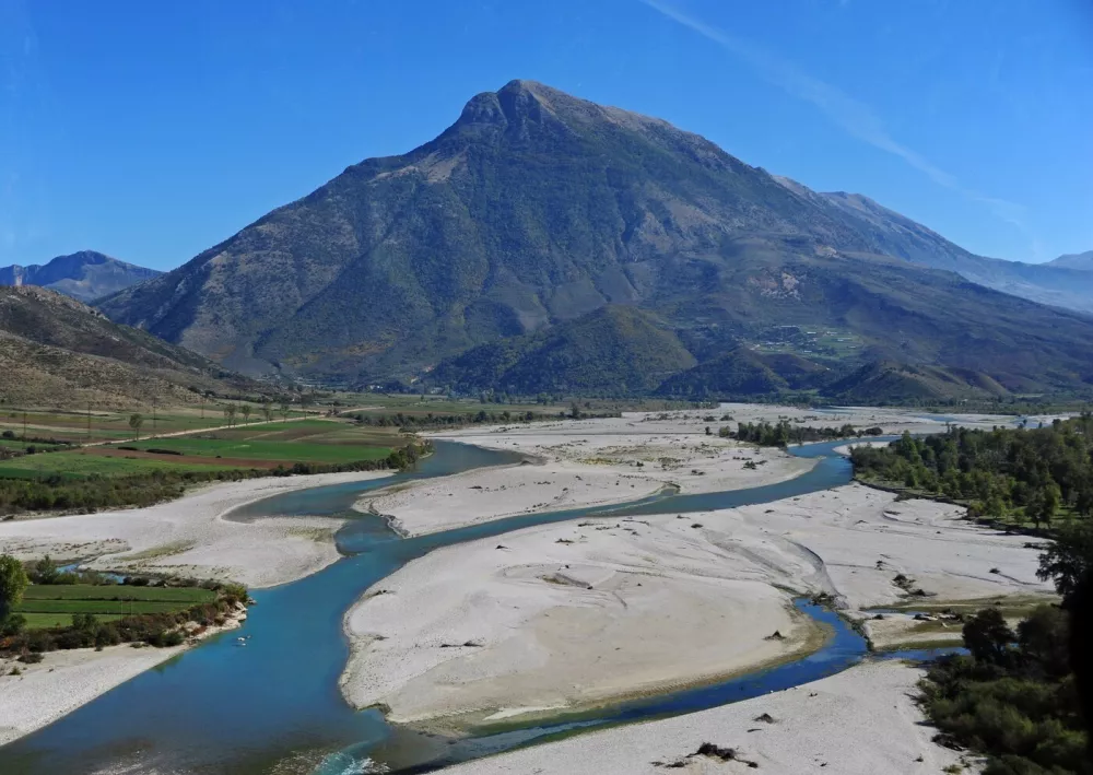 The River Vjosa (border river with Greece) - one of the last wild rivers in Europe - with a natural river course and a broad gravel bar, pictured on 16.10.2017. Photo: Reinhard Kaufhold | usage worldwide,Image: 679325352, License: Rights-managed, Restrictions:, Model Release: no 