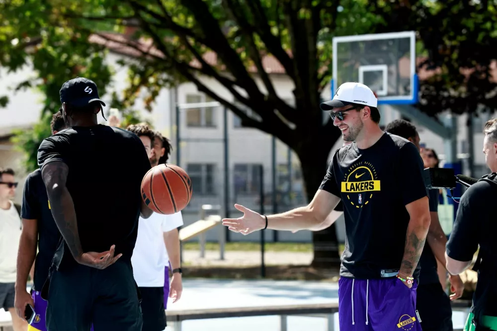Basketball - NBA - Los Angeles Lakers visit to Ljubljana - Ljubljana, Slovenia - August 23, 2026 Los Angeles Lakers' Luka Doncic on the court where he played growing up in Ljubljana REUTERS/Borut Zivulovic