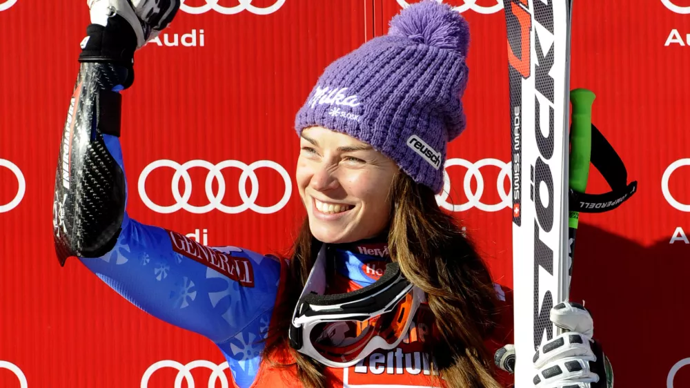Slovenia's Tina Maze celebrates on the podium after winning an alpine ski, women's World Cup super-G, in St. Anton, Austria, Sunday, Jan. 13, 2013. (AP Photo/Giovanni Auletta)
