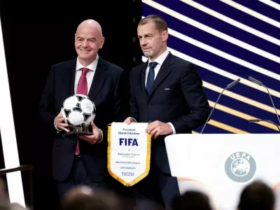 FILE PHOTO: Soccer Football - 50th Ordinary UEFA Congress - Brussels Expo, Brussels, Belgium - February 12, 2026 UEFA president Aleksander Ceferin and FIFA president Gianni Infantino pose for a photograph during the event REUTERS/Benoit Tessier/File Photo