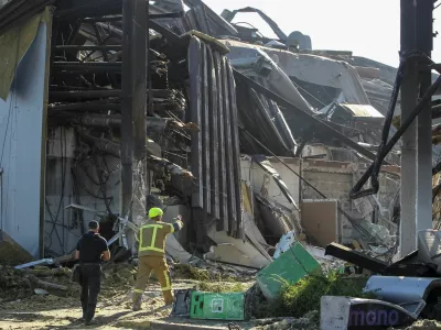 Rescuers work at the site of a shopping centre destroyed by yesterday's Russian drone attack, amid Russia's attack on Ukraine, in the city of Kryvyi Rih, Dnipropetrovsk region, Ukraine, August 22, 2026. REUTERS/Stringer