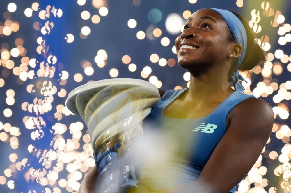 Aug 23, 2026; Cincinnati, OH, USA; Coco Gauff (USA) celebrates with the Rookwood Cup after defeating Jessica Pegula (USA) during the finals of the Cincinnati Open at Lindner Family Tennis Center. Mandatory Credit: Aaron Doster-Imagn Images