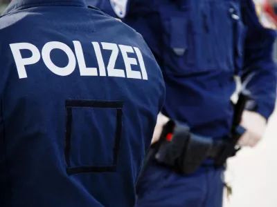 Vienna Police Force in Heldenplatz Square on Austrian National Day Parade Autumn Cityscape, Focus on Police Inscription in the Foreground (Vienna Provincial Police Force, Hofburg Complex and Vienna Ring Road in the Neighborhood, in Innere Stadt 1st District, Vienna, Austria, European Union, UNESCO World Heritage Site - October 26, 2025 - Austrian National Day as National Holiday in Austria)