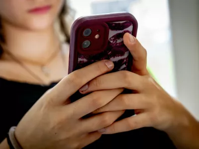 ILLUSTRATIVE - A teenage girl on her mobile phone. A 2014 Maastricht University study found that 70% of young people under 21 are addicted to their mobile phones. More than 1,400 doctors, scientists, and experts are calling on politicians to establish age limits for smartphone and social media use. ANP / Hollandse Hoogte / ROBIN UTRECHT netherlands out - belgium out,Image: 1043876761, License: Rights-managed, Restrictions:, Model Release: no 