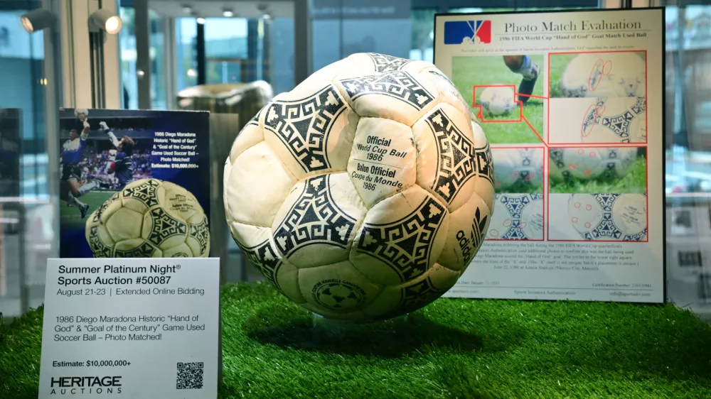 The ball that was used in the 1986 World Cup match between Argentina and England during which Argentina's Diego Maradona scored the "Hand of God" goal is displayed before auction at Heritage Auctions in Beverly Hills, California, on August 7, 2026. The ball that Maradona used to score his infamous "Hand of God" goal is expected to sell for $10 million at a US auction this month. Maradona's goal in the quarter-final match at the Estadio Azteca saw him punch the ball past the England goalkeeper, with the South Americans ultimately winning 2-1.,Image: 1121403624, License: Rights-managed, Restrictions:, Model Release: no 
