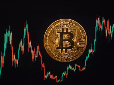 FILED - 21 November 2024, Berlin: A Bitcoin coin lies on a screen showing the Bitcoin - US dollar exchange rate. Photo: Fernando Gutierrez-Juarez/dpa