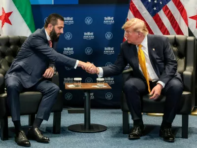 FILE PHOTO: U.S. President Donald Trump shakes hands with Syrian President Ahmed al-Sharaa during a bilateral meeting alongside the NATO leaders summit at the Bestepe Presidential Compound in Ankara, Turkey, July 8, 2026. REUTERS/Jonathan Ernst/File Photo