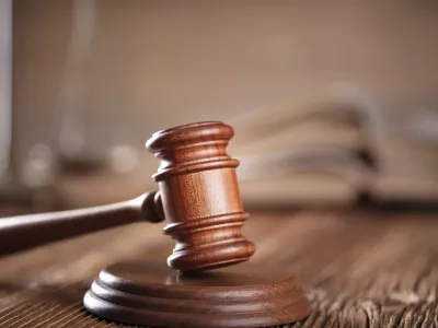 Lawyers office. Gavel on the rustic brown desk.