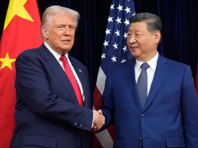 FILE - President Donald Trump, left, and Chinese President Xi Jinping shake hands before their meeting at Gimhae International Airport in Busan, South Korea, Oct. 30, 2025. (AP Photo/Mark Schiefelbein, File)