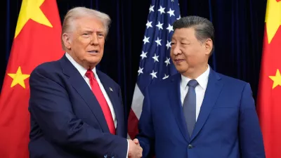 FILE - President Donald Trump, left, and Chinese President Xi Jinping shake hands before their meeting at Gimhae International Airport in Busan, South Korea, Oct. 30, 2025. (AP Photo/Mark Schiefelbein, File)