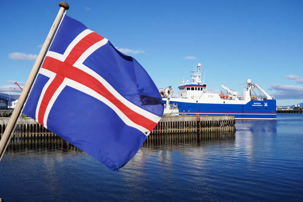 An Icelandic flag waves in the wind at Reykjavik Harbor in Reykjavik, Iceland, Sunday, Aug. 9, 2026. (AP Photo/James Brooks)