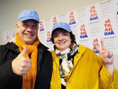 Supporters pose for a photo at the opening of the "Yes" campaign's office in Reykjavik, Iceland, Friday, Aug. 7, 2026. (AP Photo/James Brooks)