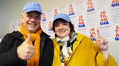 Supporters pose for a photo at the opening of the "Yes" campaign's office in Reykjavik, Iceland, Friday, Aug. 7, 2026. (AP Photo/James Brooks)