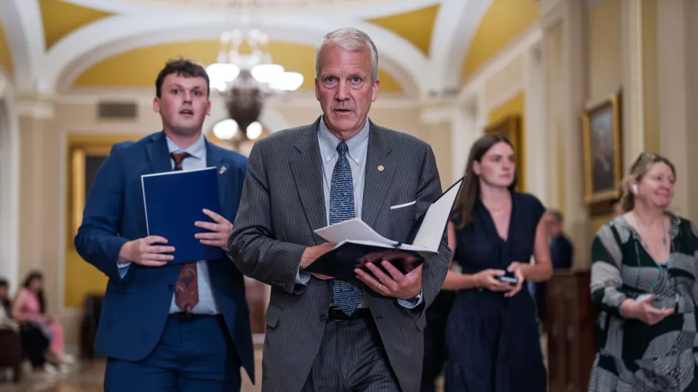 Sen. Dan Sullivan, R-Alaska, heads to a closed-door meeting with fellow Republicans, at the Capitol in Washington, Tuesday, June 2, 2026. (AP Photo/J. Scott Applewhite)