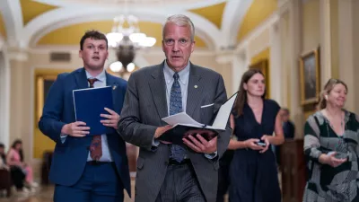 Sen. Dan Sullivan, R-Alaska, heads to a closed-door meeting with fellow Republicans, at the Capitol in Washington, Tuesday, June 2, 2026. (AP Photo/J. Scott Applewhite)