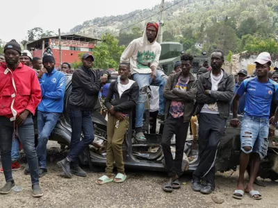 Residents gather during a protest against insecurity after a fatal overnight raid by an armed gang, on the outskirts of Port-au-Prince, in Kenscoff, Haiti, August 24, 2026. REUTERS/Fildor Pq Egeder