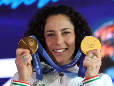 Italy's alpine skier Federica Brignone shows her two gold medals after a press conference in Cortina d'Ampezzo, Italy, February 16, 2026. REUTERS/Leonhard Foeger
