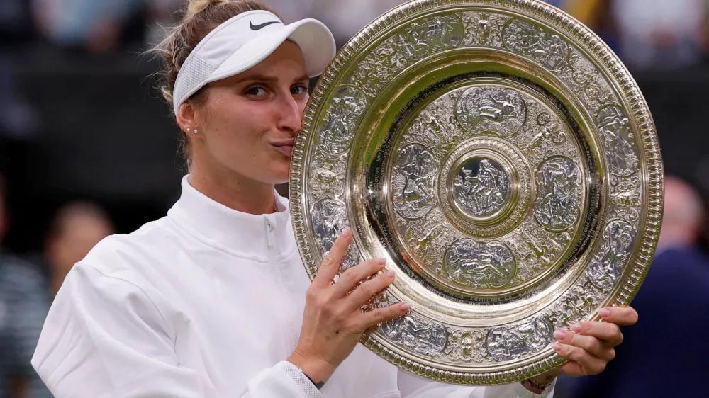 FILE PHOTO: Tennis - Wimbledon - All England Lawn Tennis and Croquet Club, London, Britain - July 15, 2023 Czech Republic's Marketa Vondrousova celebrates with the trophy winning her final match against Tunisia's Ons Jabeur REUTERS/Andrew Couldridge/File Photo