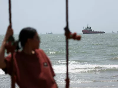 A person looks on, as vessels in the Strait of Hormuz are visible near the beach of Bandar Abbas, Iran, August 25, 2026. Majid Asgaripour/WANA (West Asia News Agency) via REUTERS ATTENTION EDITORS - THIS PICTURE WAS PROVIDED BY A THIRD PARTY. ISRAEL OUT. NO COMMERCIAL OR EDITORIAL SALES IN ISRAEL. NO ACCESS FOR ISRAELI MEDIA. NO USE BBC PERSIAN. NO USE VOA PERSIAN. NO USE MANOTO. NO USE IRAN INTERNATIONAL. NO USE RADIO FARDA. DIGITAL: NO USE BBC PERSIAN. NO USE VOA PERSIAN. NO USE MANOTO. NO USE IRAN INTERNATIONAL. NO USE RADIO FARDA.
