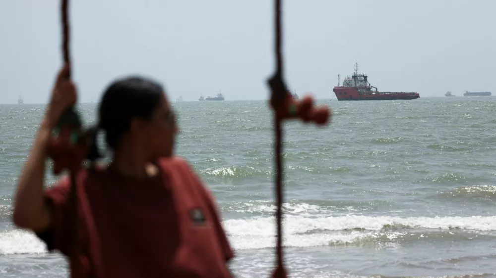 A person looks on, as vessels in the Strait of Hormuz are visible near the beach of Bandar Abbas, Iran, August 25, 2026. Majid Asgaripour/WANA (West Asia News Agency) via REUTERS ATTENTION EDITORS - THIS PICTURE WAS PROVIDED BY A THIRD PARTY. ISRAEL OUT. NO COMMERCIAL OR EDITORIAL SALES IN ISRAEL. NO ACCESS FOR ISRAELI MEDIA. NO USE BBC PERSIAN. NO USE VOA PERSIAN. NO USE MANOTO. NO USE IRAN INTERNATIONAL. NO USE RADIO FARDA. DIGITAL: NO USE BBC PERSIAN. NO USE VOA PERSIAN. NO USE MANOTO. NO USE IRAN INTERNATIONAL. NO USE RADIO FARDA.