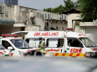 Ambulances are parked outside a mortuary following a deadly fire at the Pakistan Institute of Medical Sciences (PIMS) hospital in Islamabad, Pakistan, August 26, 2026. REUTERS/Akhtar Soomro
