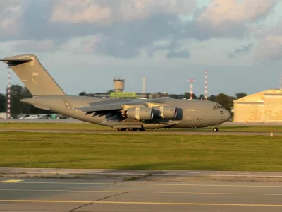 A C-17 Globemaster, believed to be carrying U.S. CIA Director John Ratcliffe, lands near Riga, Latvia, August 25, 2026, in this frame obtained from a social media video. @ALFREDSPODINS VIA X/via REUTERS THIS IMAGE HAS BEEN SUPPLIED BY A THIRD PARTY. MANDATORY CREDIT.