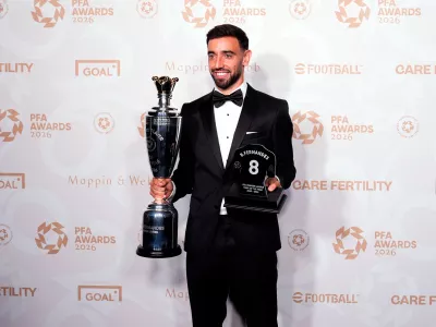 Bruno Fernandes with his PFA players player of the year award during the PFA Awards 2026 at Manchester Opera House, Manchester, England, Tuesday Aug. 25, 2026. (Peter Byrne/PA via AP)