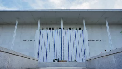 FILE PHOTO: A tarp covers the facade of the John F. Kennedy Memorial Center for the Performing Arts, following a federal judge's order to remove U.S. President Donald Trump's name from the institution, in Washington, D.C., U.S., June 13, 2026. REUTERS/Ken Cedeno/File Photo