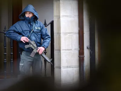 A Spanish Guardia Civil policeman stands guard outside a post office in the small northern town of Alsasua, Spain, Tuesday, Dec. 6, 2005, after a small bomb, blamed on ETA by the police, exploded. Another five small bombs exploded on highways close to the Spanish capital Tuesday, following a warning call in the name of the armed Basque group ETA, in which no one was injured. The explosions occurred on a major national holiday commemorating the 27th anniversary of Constitution Day with millions of Spaniards taking the roads for brief vacation breaks. (AP Photo/Alvaro Barrientos)