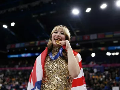 FILE PHOTO: Milano Cortina 2026 Olympics - Figure Skating - Women Single Skating - Victory Ceremony - Milano Ice Skating Arena, Milan, Italy - February 19, 2026. Gold medallist Alysa Liu of United States celebrates after winning the Women Single Skating REUTERS/Amanda Perobelli/File Photo