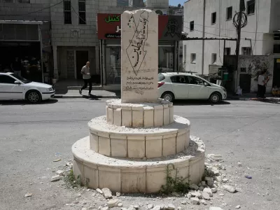 A damaged monument in the West Bank village of Madama, which bears the names of Palestinians killed in the Israeli-Palestinian conflict, including some identified by Israel as having been involved in attacks, after far-right Israeli lawmaker Zvi Sukkot of the Religious Zionism party smashed it, Tuesday, Aug. 25, 2026. (AP Photo/Majdi Mohammed)