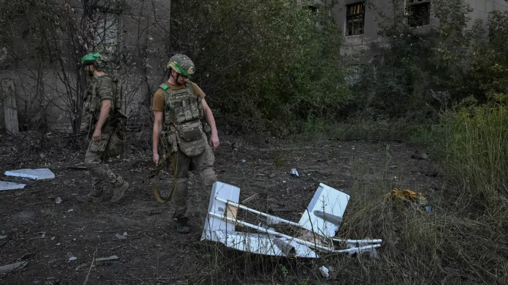 Servicemen of the Unmanned Systems Unit of Special Rifle Police Battalion inspect a shot down Russian combat drone, amid Russia's attack on Ukraine, in the frontline town of Druzhkivka, in Donetsk region, Ukraine August 24, 2026. REUTERS/Stringer
