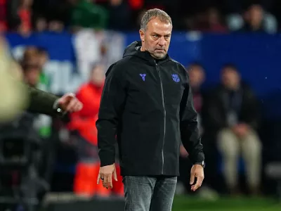 Barcelona's head coach Hansi Flick stands on the touchline during a Spanish La Liga soccer match between Osasuna and Barcelona in Pamplona, Spain, Saturday, May 2, 2026. (AP Photo/Miguel Oses)