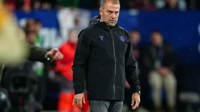 Barcelona's head coach Hansi Flick stands on the touchline during a Spanish La Liga soccer match between Osasuna and Barcelona in Pamplona, Spain, Saturday, May 2, 2026. (AP Photo/Miguel Oses)