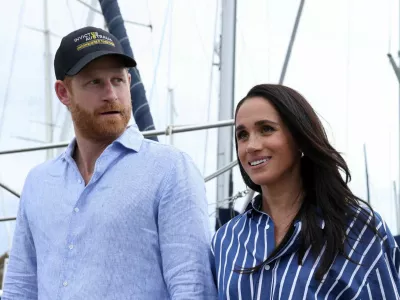 FILE PHOTO: Britain's Prince Harry and Meghan, the Duke and Duchess of Sussex, disembark after sailing on Sydney Harbour with veterans from the Invictus Australia community, in Sydney, Australia, April 17, 2026. REUTERS/Hollie Adams/File Photo