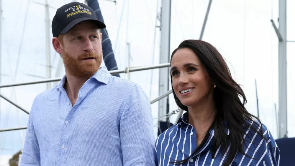 FILE PHOTO: Britain's Prince Harry and Meghan, the Duke and Duchess of Sussex, disembark after sailing on Sydney Harbour with veterans from the Invictus Australia community, in Sydney, Australia, April 17, 2026. REUTERS/Hollie Adams/File Photo