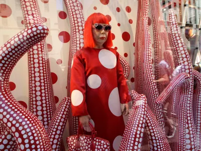 FILE - A wax model of Japanese artist Yayoi Kusama is displayed in the windows of Louis Vuitton's flagship Fifth Avenue store in New York, Tuesday, July 10, 2012. (AP Photo/Kathy Willens, File)