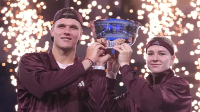 Jakub Mensik, left, and Karolina Muchova, both of the Czech Republic, pose with the trophy after defeating Belinda Bencic, of Switzerland, and Flavio Cobolli, of Italy, in the mixed doubles final match at the U.S. Open tennis championships Thursday, Aug. 27, 2026, in New York. (AP Photo/Frank Franklin II)