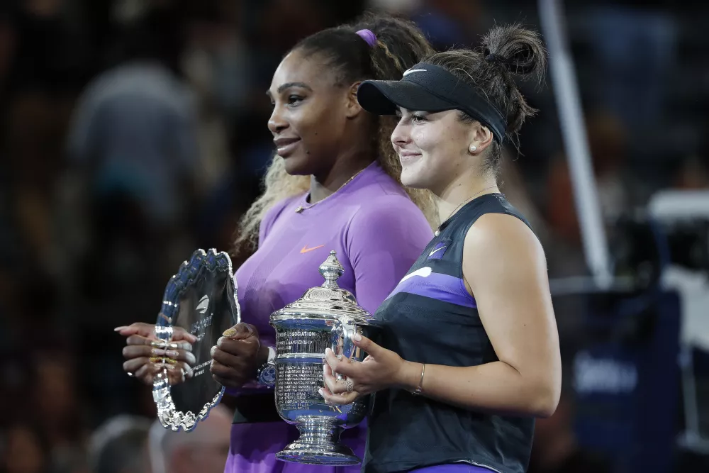 Sep 7, 2019; Flushing, NY, USA; Bianca Andreescu of Canada (R) holds the championship trophy as Serena Williams of the United States (L) holds the finalistŐs trophy during the trophy ceremony after their match in the womenŐs final on day thirteen of the 2019 US Open tennis tournament at USTA Billie Jean King National Tennis Center. Mandatory Credit: Geoff Burke-USA TODAY Sports