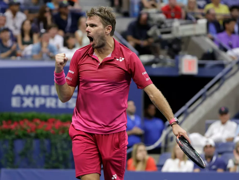 FILE - Stan Wawrinka, of Switzerland, reacts after a point against Novak Djokovic, of Serbia, during the men's singles final of the U.S. Open tennis tournament, on Sept. 11, 2016, in New York. (AP Photo/Darron Cummings, File)