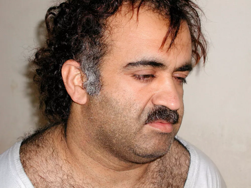 Khalid Sheikh Mohammed is shown in this file photograph during his arrest on March 1, 2003. Accused September 11 plotter Khalid Sheikh Mohammed is likely to be executed after being tried and convicted, White House spokesman Robert Gibbs said on January 31, 2010. The Obama administration has begun looking for places other than the heart of New York City to prosecute Mohammed and four alleged co-conspirators in the face of fierce criticism tied to security and costs.   REUTERS/Courtesy U.S.News & World Report/Files (UNITED STATES - Tags: CRIME LAW CIVIL UNREST POLITICS)