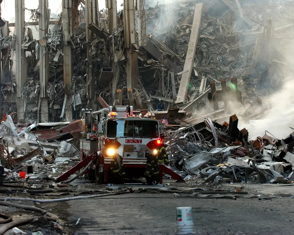 010916-N-7479T-501Ground Zero, New York City, N.Y. (Sept. 16, 2001) -- A lone fire engine at the crime scene in Manhattan where the World Trade Center collapsed following the Sept. 11 terrorist attack. Surrounding buildings were heavily damaged by the debris and massive force of the falling twin towers. Clean-up efforts are expected to continue for months. U.S. Navy photo by Chief Photographer's Mate Eric J. TIlford. (RELEASED)