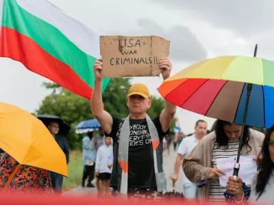 Protesters hold signs, including one opposing the United States, as they gather near Bezmer Air Base near Yambol, Bulgaria, on July 24, 2026, to demonstrate against the deployment of eight US aircraft and 250 personnel. The KC-135 planes are intended for air refueling during US military operations against Iran. Demonstrators have expressed concerns that the air base could become a target for Iran.People Protest Against Deployment Of Eight US Aircraft And 250 Personnel At Bezmer Air Base Near Yambol, Bulgaria, Bezmer Village, Yambol - 24 Jul 2026,Image: 1118392152, License: Rights-managed, Restrictions:, Model Release: no 