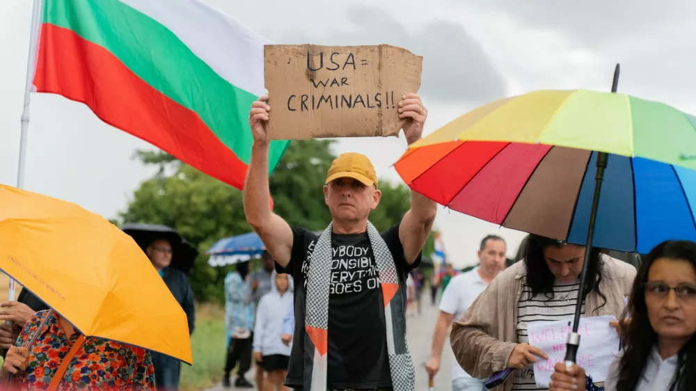 Protesters hold signs, including one opposing the United States, as they gather near Bezmer Air Base near Yambol, Bulgaria, on July 24, 2026, to demonstrate against the deployment of eight US aircraft and 250 personnel. The KC-135 planes are intended for air refueling during US military operations against Iran. Demonstrators have expressed concerns that the air base could become a target for Iran.People Protest Against Deployment Of Eight US Aircraft And 250 Personnel At Bezmer Air Base Near Yambol, Bulgaria, Bezmer Village, Yambol - 24 Jul 2026,Image: 1118392152, License: Rights-managed, Restrictions:, Model Release: no 