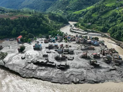 A drone view shows mud covering buildings and property following devastating floods at Trishuli in Nuwakot district, Nepal, August 27, 2026. REUTERS/Navesh Chitrakar
