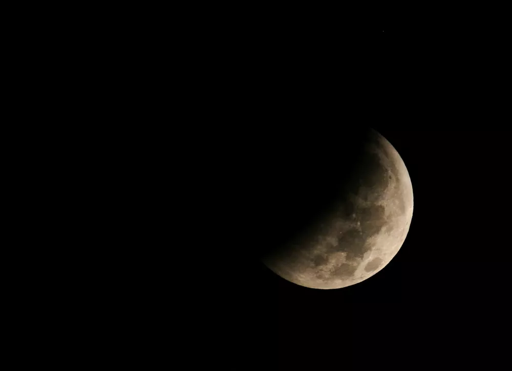 The moon during a partial lunar eclipse appears in the sky over Benghazi, Libya, August 28, 2026. REUTERS/Esam Omran Al-Fetori