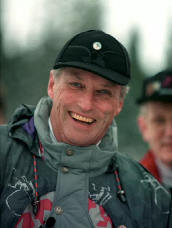 Norway's King Harald, wearing a jacket from the Lillehammer Olympics, and a hat with the Norwegian Ski Association's pin, attends the Norwegian Ski Championships, in Skrautval, Norway, January 26, 1990. NTB/Lise Aserud via REUTERS  ATTENTION EDITORS - THIS IMAGE WAS PROVIDED BY A THIRD PARTY. NORWAY OUT. NO COMMERCIAL OR EDITORIAL SALES IN NORWAY.