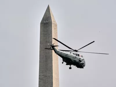Marine One with President Donald Trump on board lifts off from the Ellipse near the White House and past the Washington Monument, Thursday, Aug. 27, 2026, in Washington, en route to Houston. (AP Photo/Jacquelyn Martin)